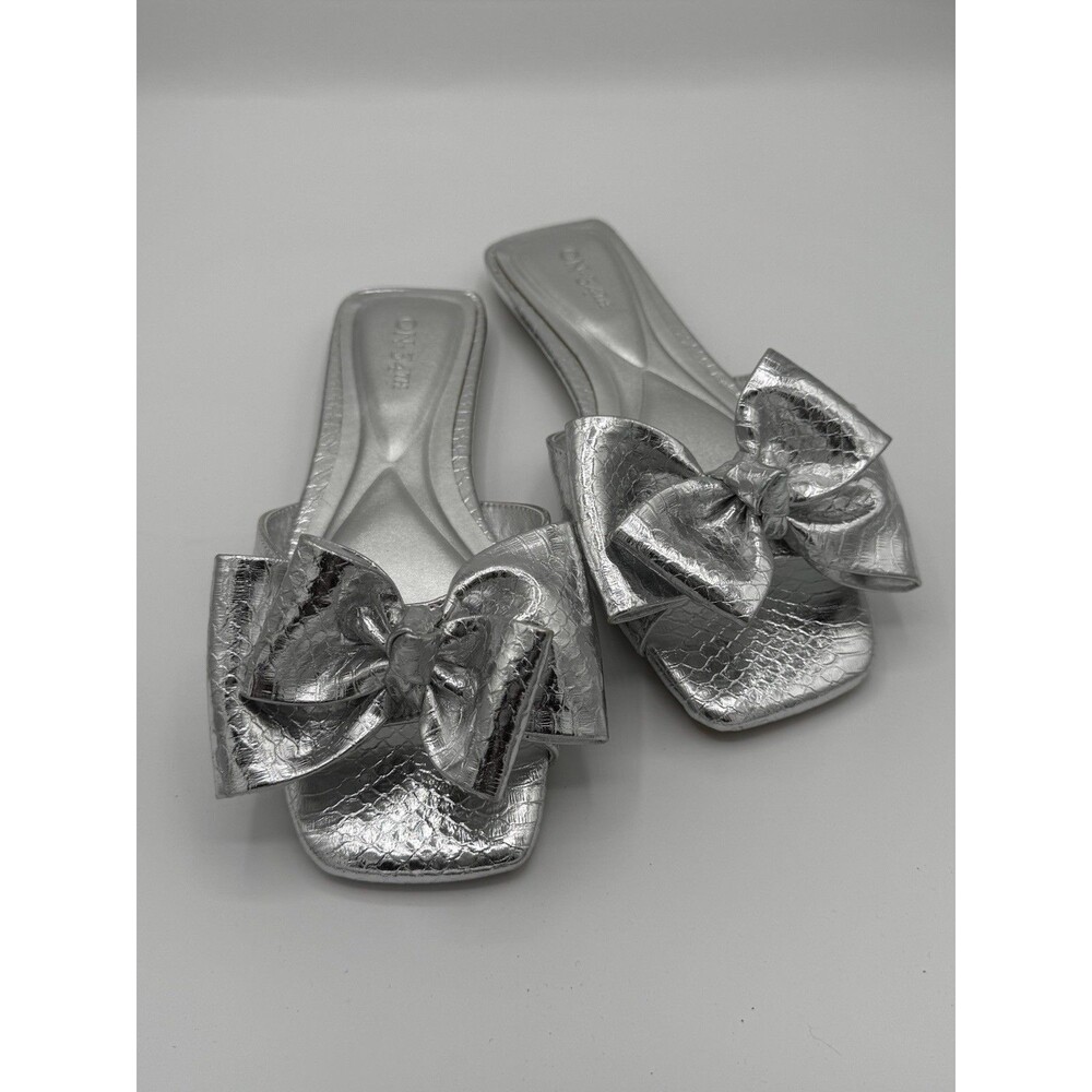 On 34th Jazminn faux leather bow slide sandals in silver snake print Women’s 6.5